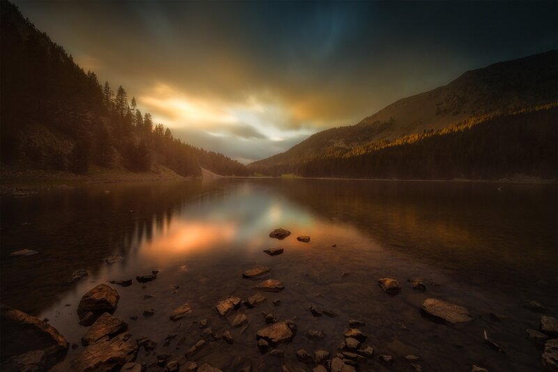 Lake at Sunset — Orange, Dramatic, Photograph, Mountains, Trees, Rocks