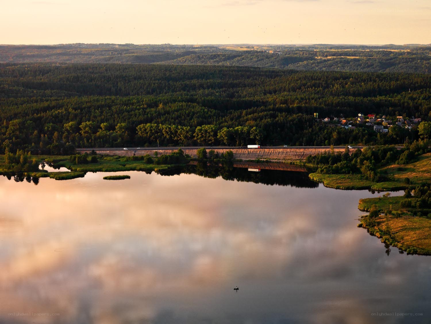 Lake at sunset with forest