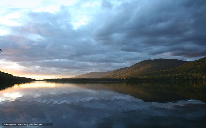 Lake at sunset with mountains