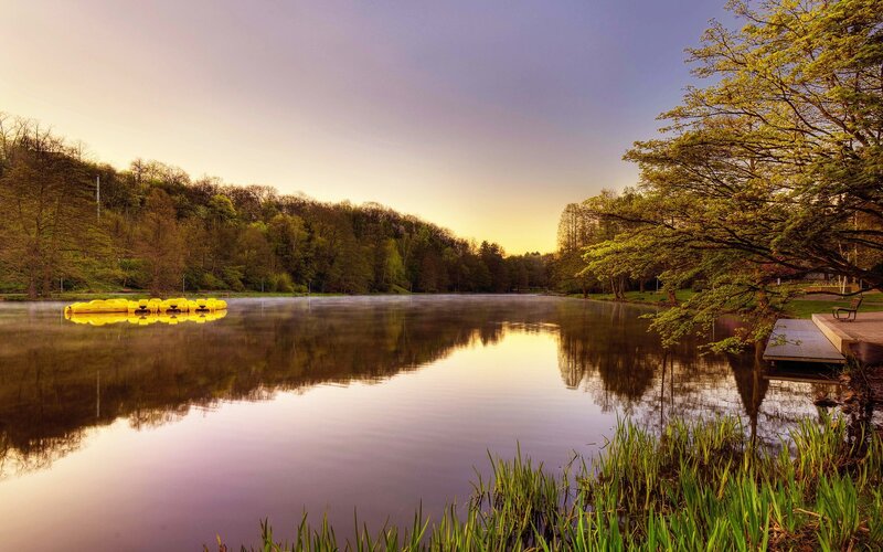 Lake at sunset with paddle boats