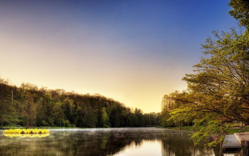 Lake at sunset with paddle boats