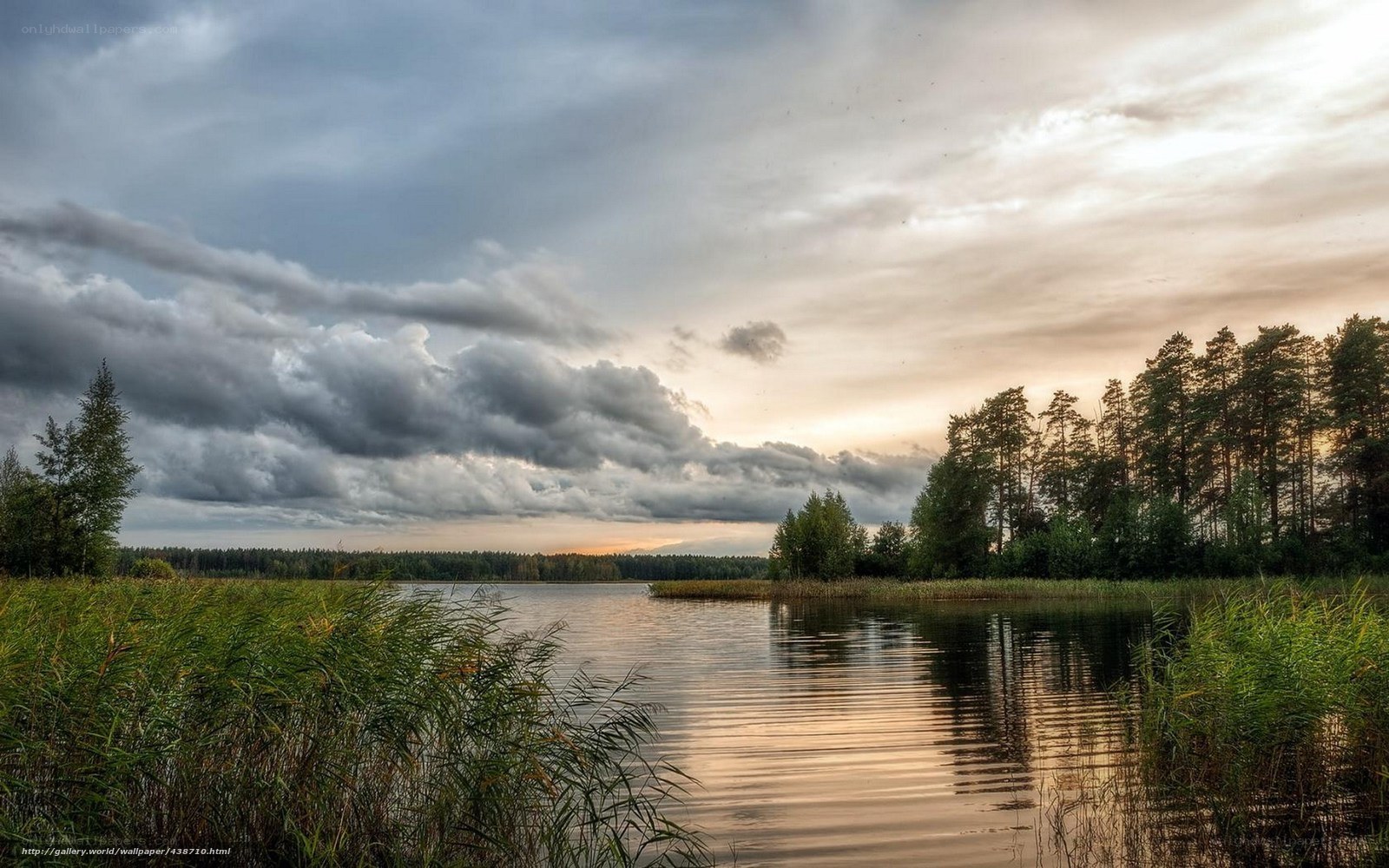 Lake at sunset with storm clouds