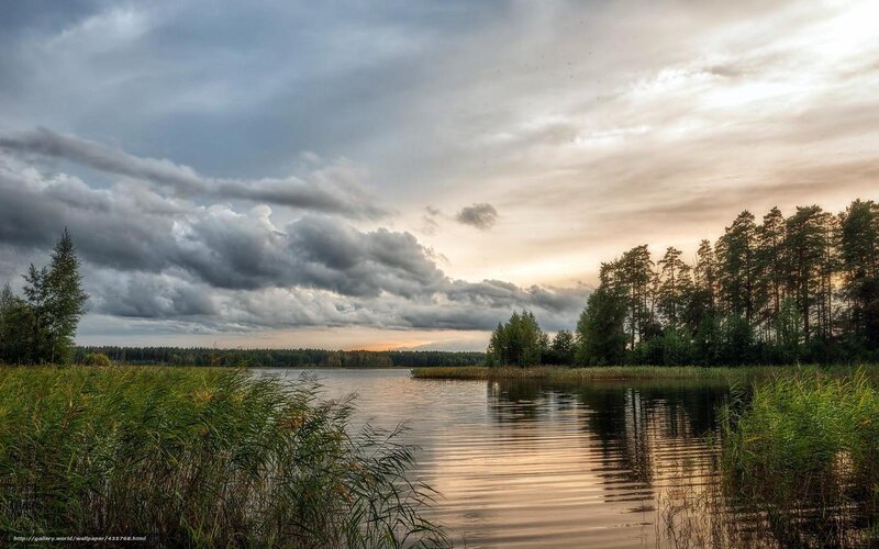 Lake at sunset with storm clouds