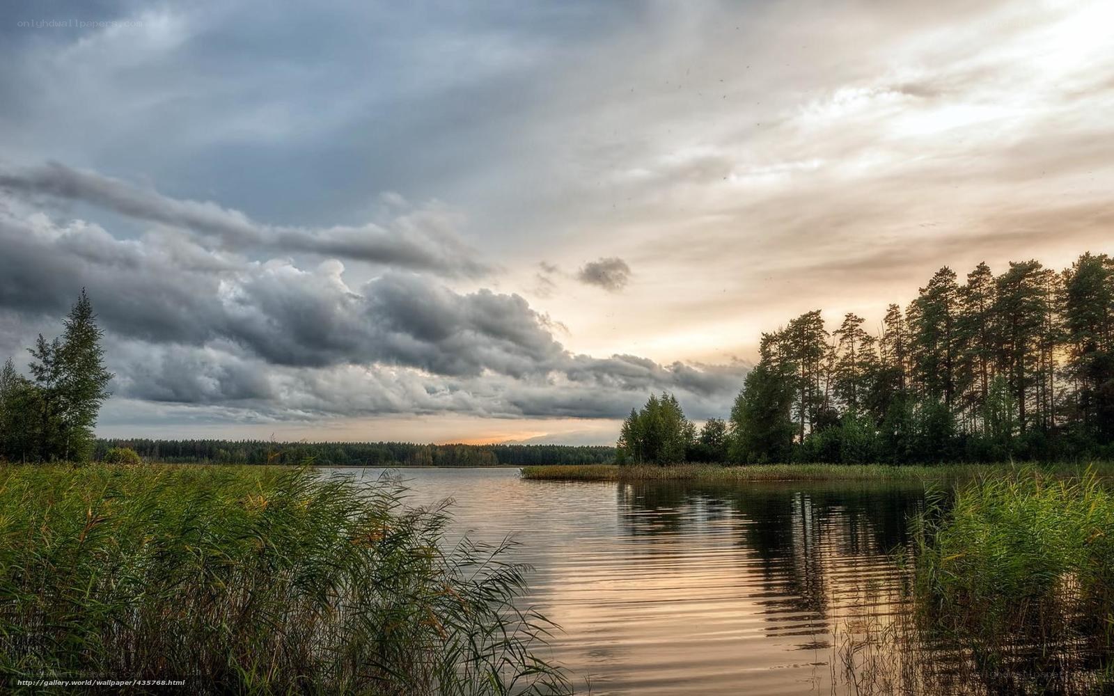 Lake at sunset with storm clouds
