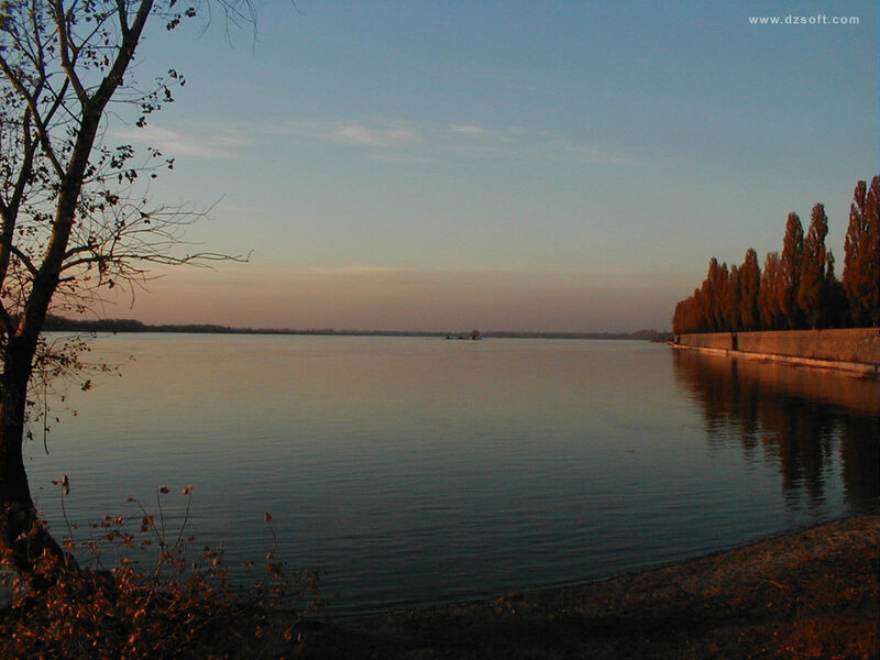 Lake at sunset with trees