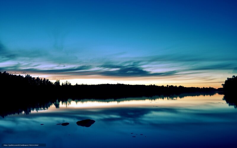 Lake at twilight with forest silhouette