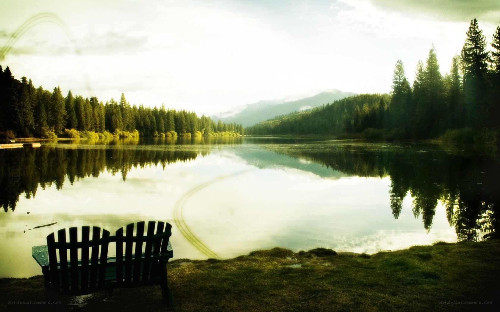 Lake bench at sunrise