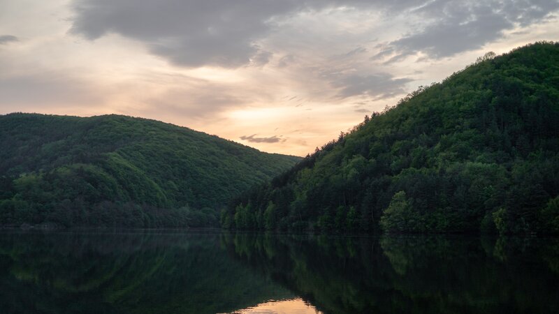 Lake Between Forested Hills — Green