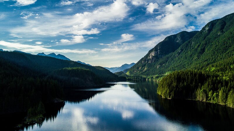 Lake Between Forested Mountains