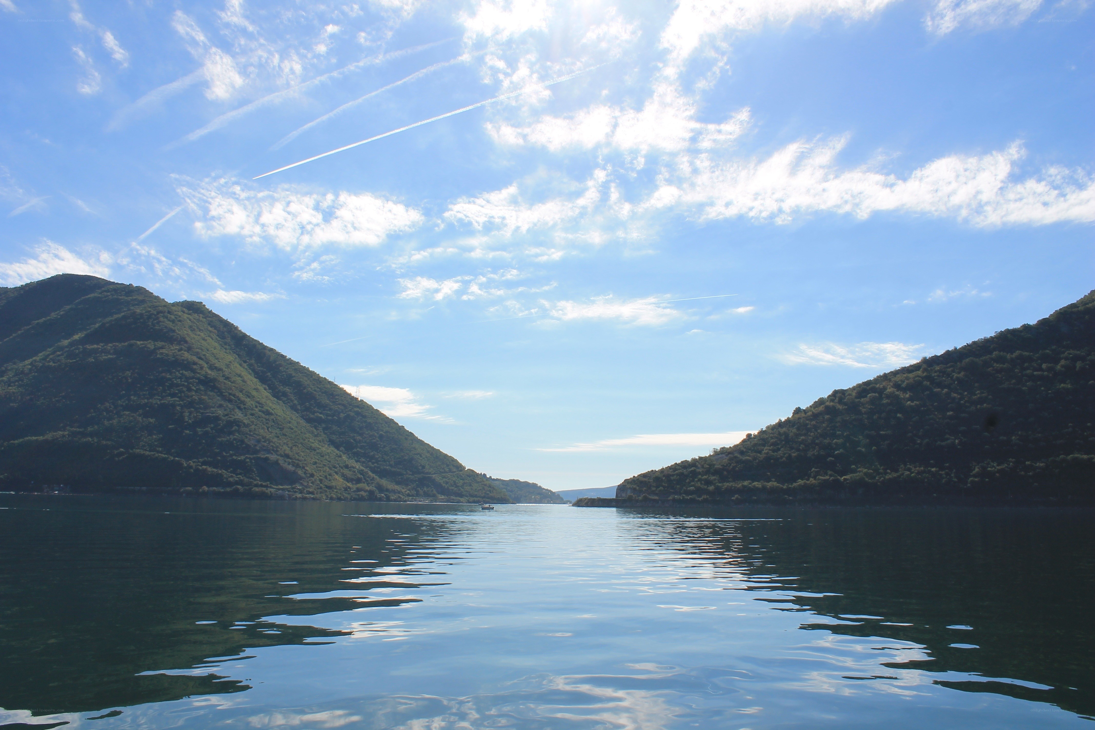 Lake between green hills