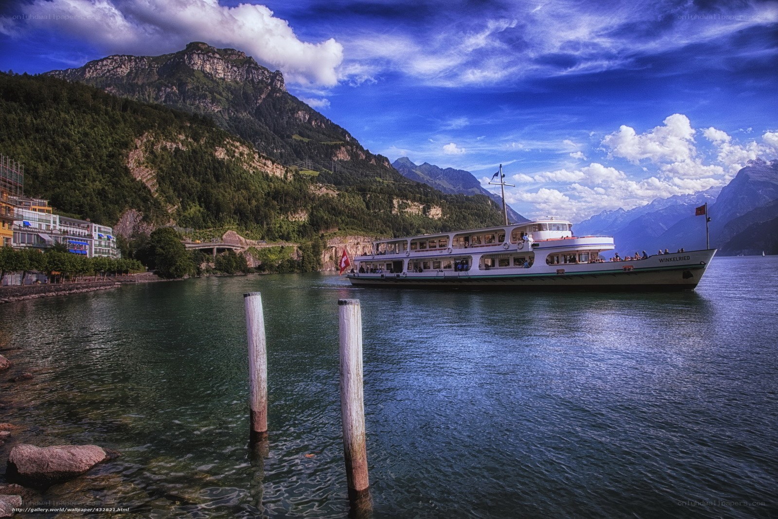 Lake boat with mountain backdrop