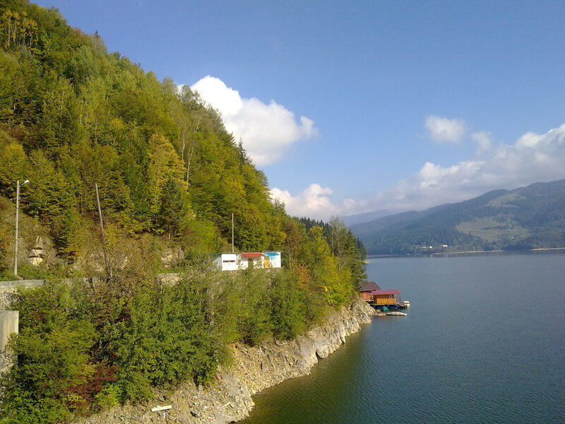Lake by forested hills