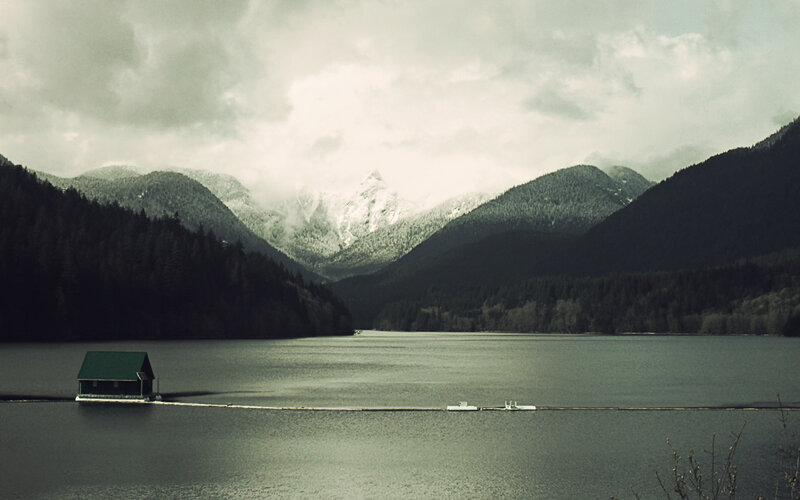 Lake cabin with mountain backdrop