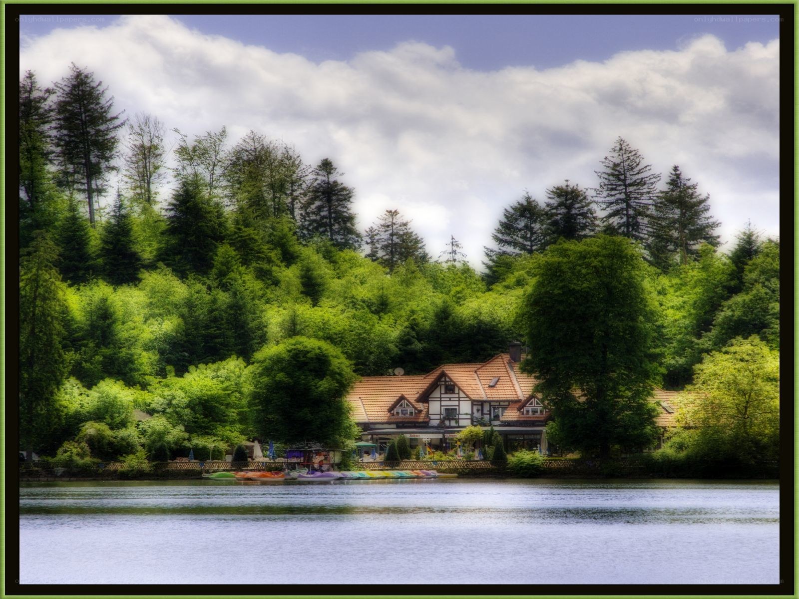 Lake house with forest backdrop