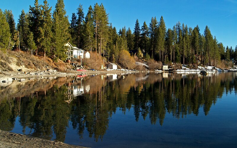 Lake house with forest reflection