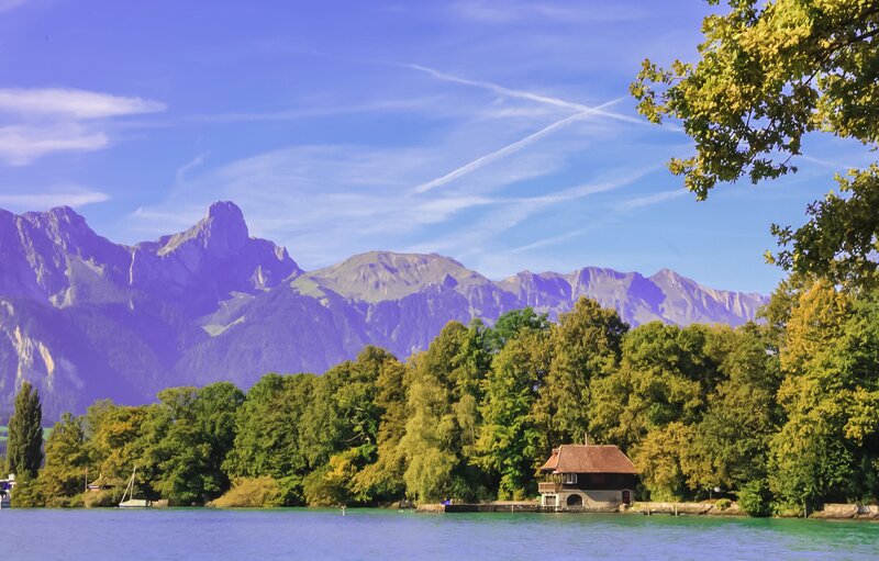 Lake House with Mountains — Blue, Serene, Afternoon, Photograph