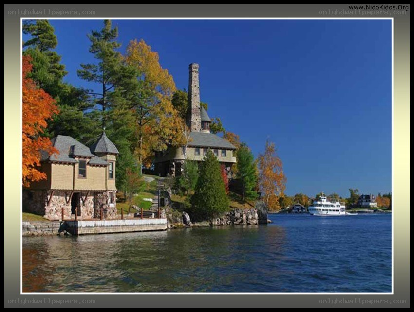 lake house with stone tower