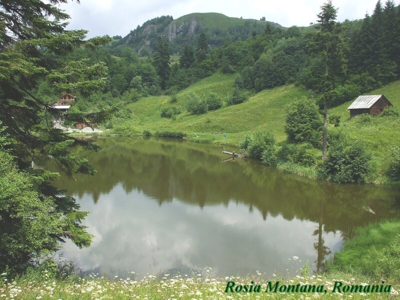 Lake in Mountain Valley — Green, Serene, Afternoon, Photograph, Huts