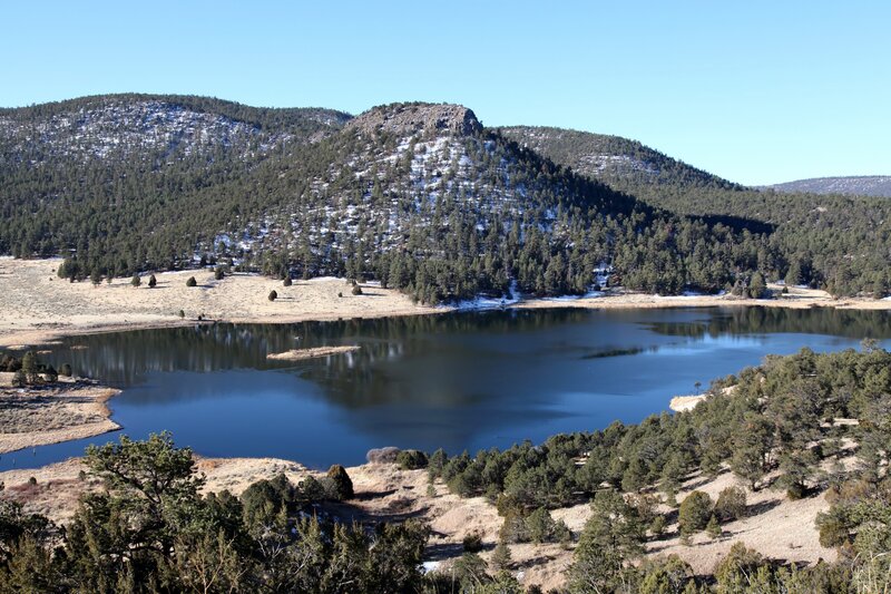 Lake in snowy mountain landscape