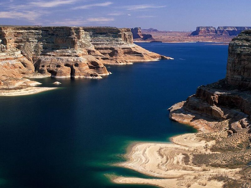 Lake Powell with red rock cliffs