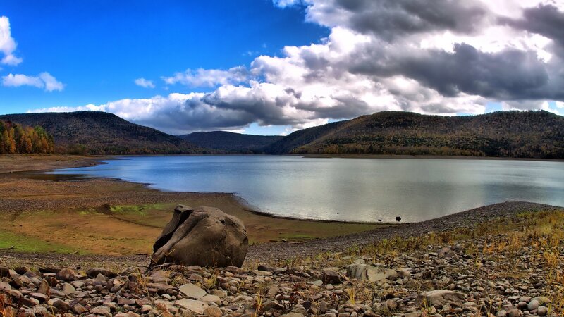 Lake surrounded by autumn hills