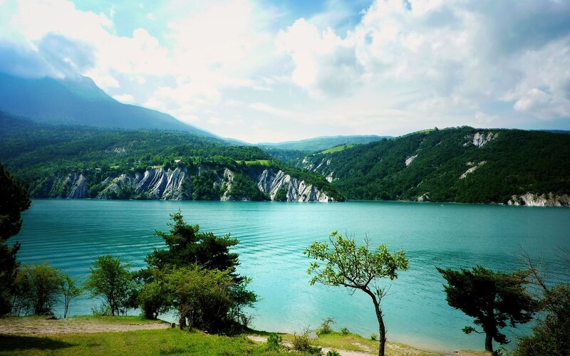 Lake Surrounded by Cliffs — Blue