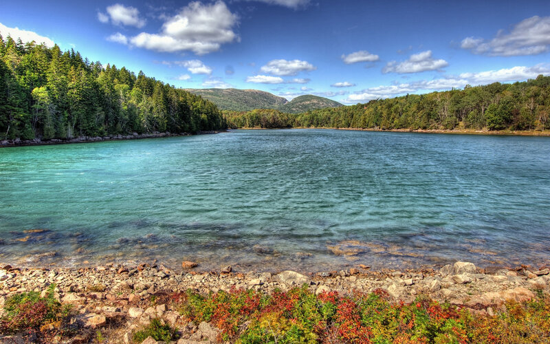 Lake Surrounded by Forest — Blue, Serene, Afternoon, Photograph, Trees, Mountains, Rocks