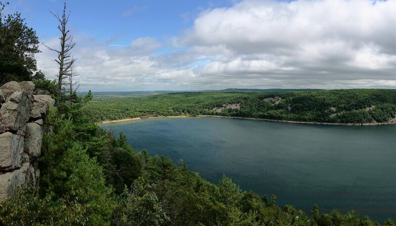 Lake Surrounded by Forest — Green, Serene, Afternoon, Photograph, Trees, Rocky Cliff