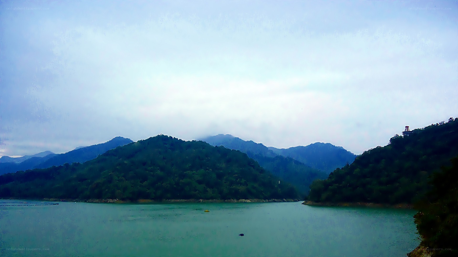 Lake surrounded by green mountains