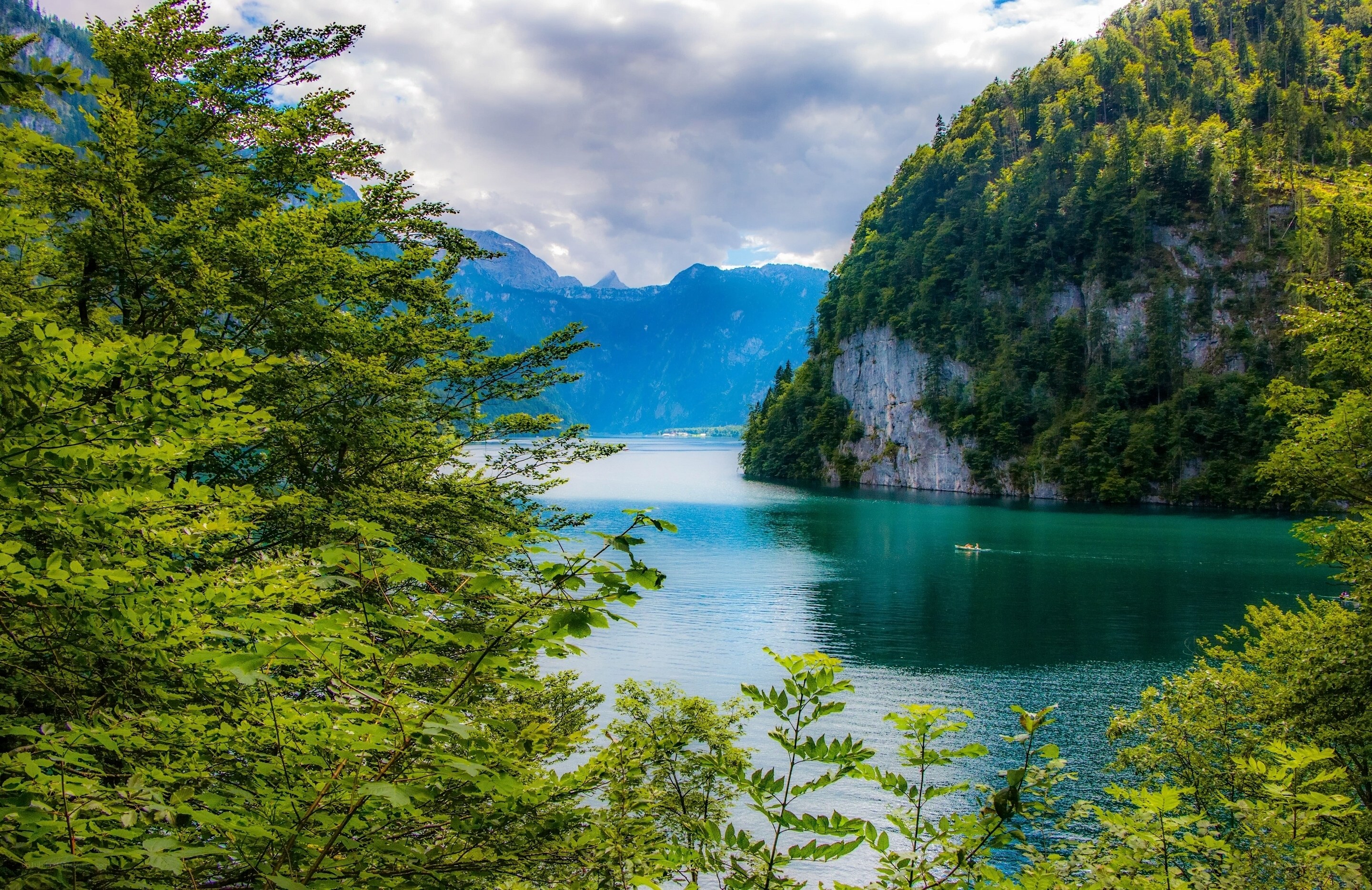 Lake surrounded by green mountains