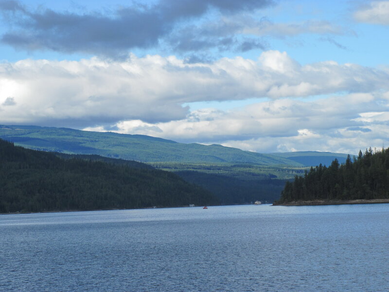 Lake Surrounded by Hills — Blue, Serene, Afternoon, Photograph, Trees, Boat