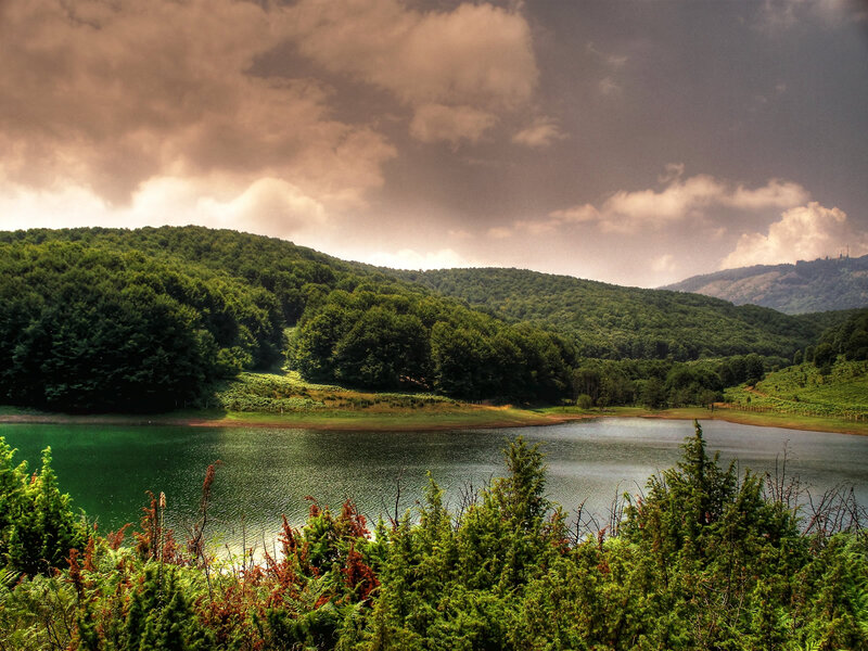 Lake Surrounded by Hills — Green, Dramatic, Afternoon