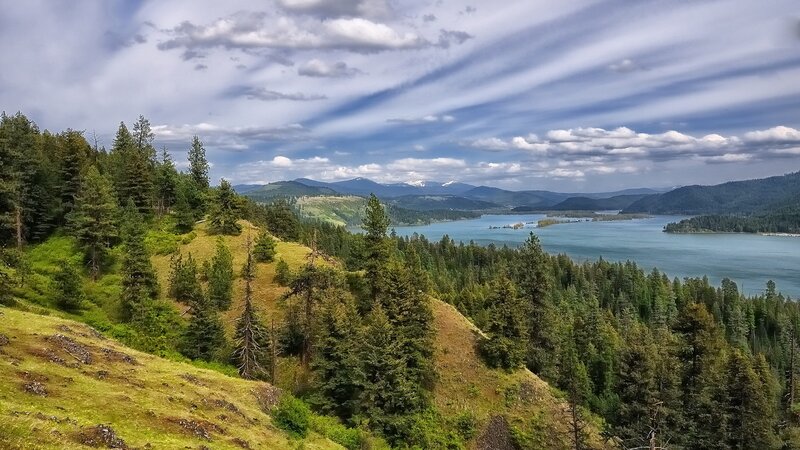 Lake Surrounded by Hills — Green, Serene, Afternoon, Photograph, Trees, Mountains