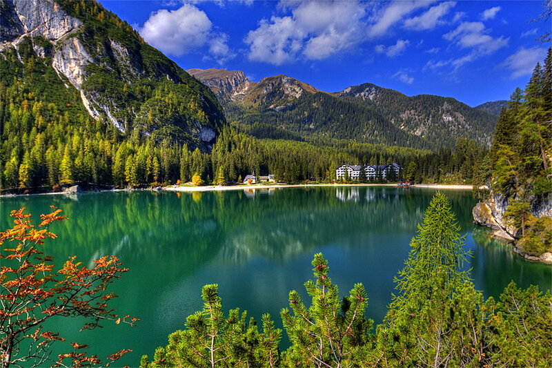 Lake Surrounded by Mountains — Blue, Serene, Afternoon, Photograph, Forest, Building