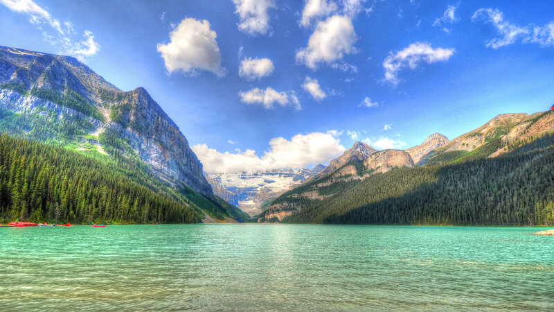 Lake Surrounded by Mountains — Blue, Serene, Afternoon, Photograph, Forest, Clouds, Kayaks