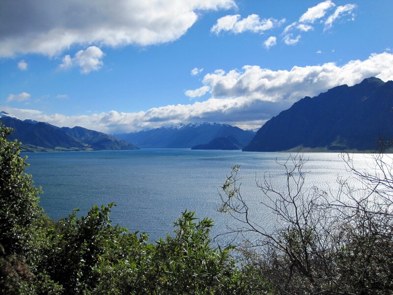 Lake Surrounded by Mountains — Blue, Serene, Afternoon, Photograph, Sky, Clouds, Trees, Green