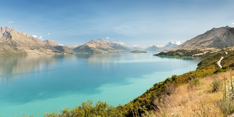 Lake Surrounded by Mountains — Blue, Serene, Afternoon, Photograph, Sky, Vegetation
