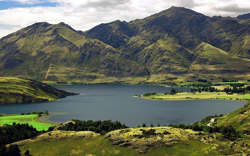 Lake Surrounded by Mountains — Green, Serene, Afternoon, Photograph, Fields