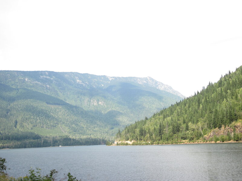 Lake Surrounded by Mountains — Green, Serene, Afternoon, Photograph, Forest