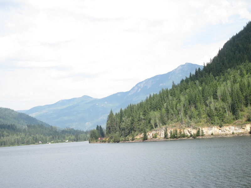 Lake Surrounded by Mountains — Green, Serene, Afternoon, Photograph, Forest, Trees