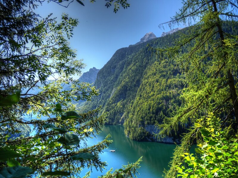 Lake Surrounded by Mountains — Green, Serene, Afternoon, Photograph, Trees, Boat