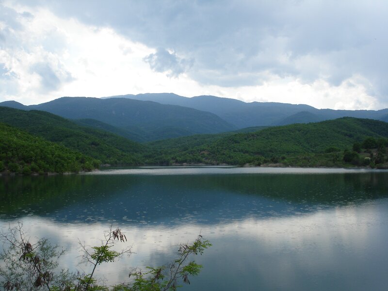 Lake Surrounded by Mountains — Green, Serene, Afternoon, Photograph, Trees, Clouds, Blue, Gray
