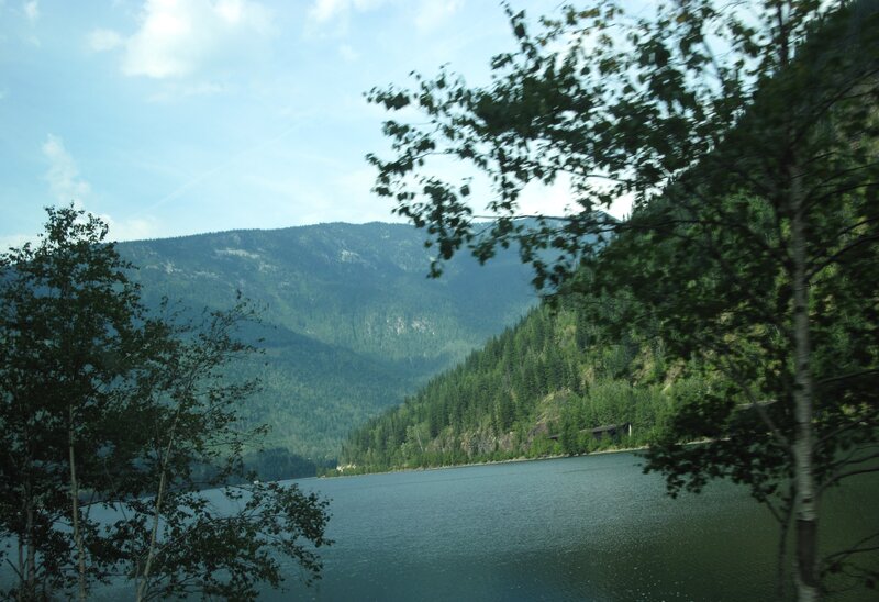 Lake Surrounded by Mountains — Green, Serene, Afternoon, Photograph, Trees, Sky