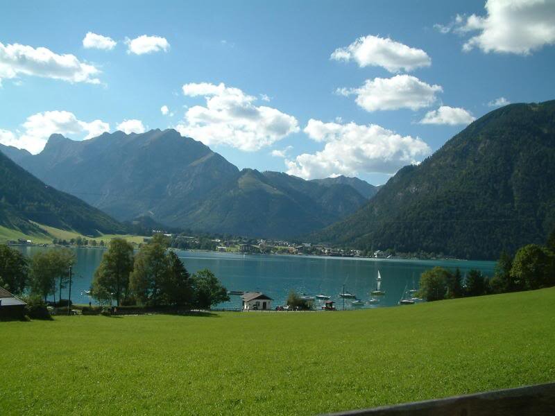 Lake Surrounded by Mountains — Green, Serene, Afternoon
