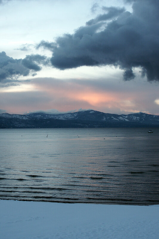 Lake Tahoe at dusk with snow