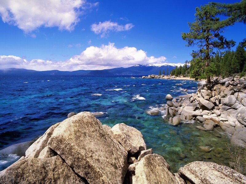 Lake Tahoe shoreline with mountains
