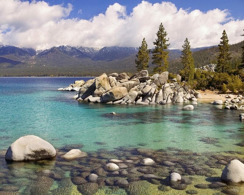 Lake Tahoe shoreline with mountains