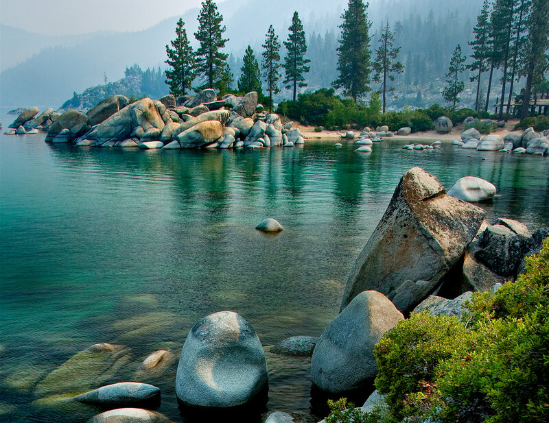 Lake Tahoe shoreline with rocks and trees