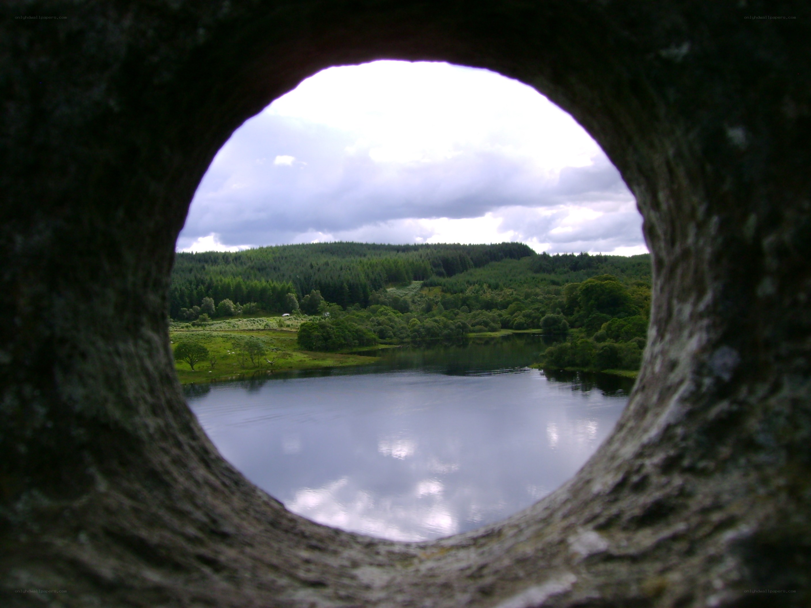 Lake view through stone hole