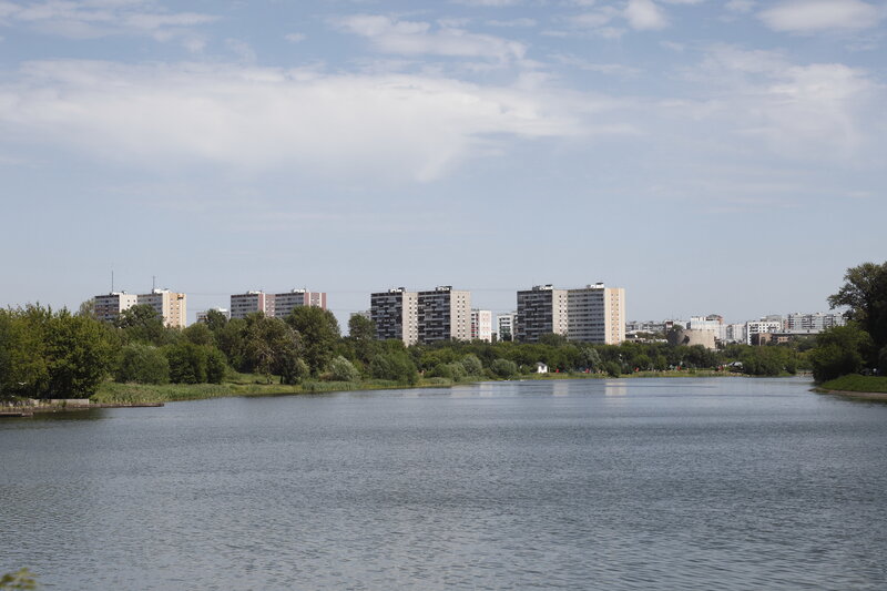 Lake with apartment buildings in background